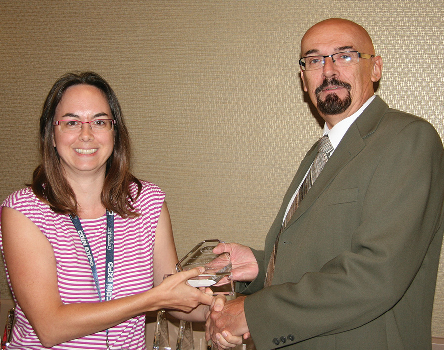 Julaine Scott receiving her presidential award from RCNA
						President Bret Evans